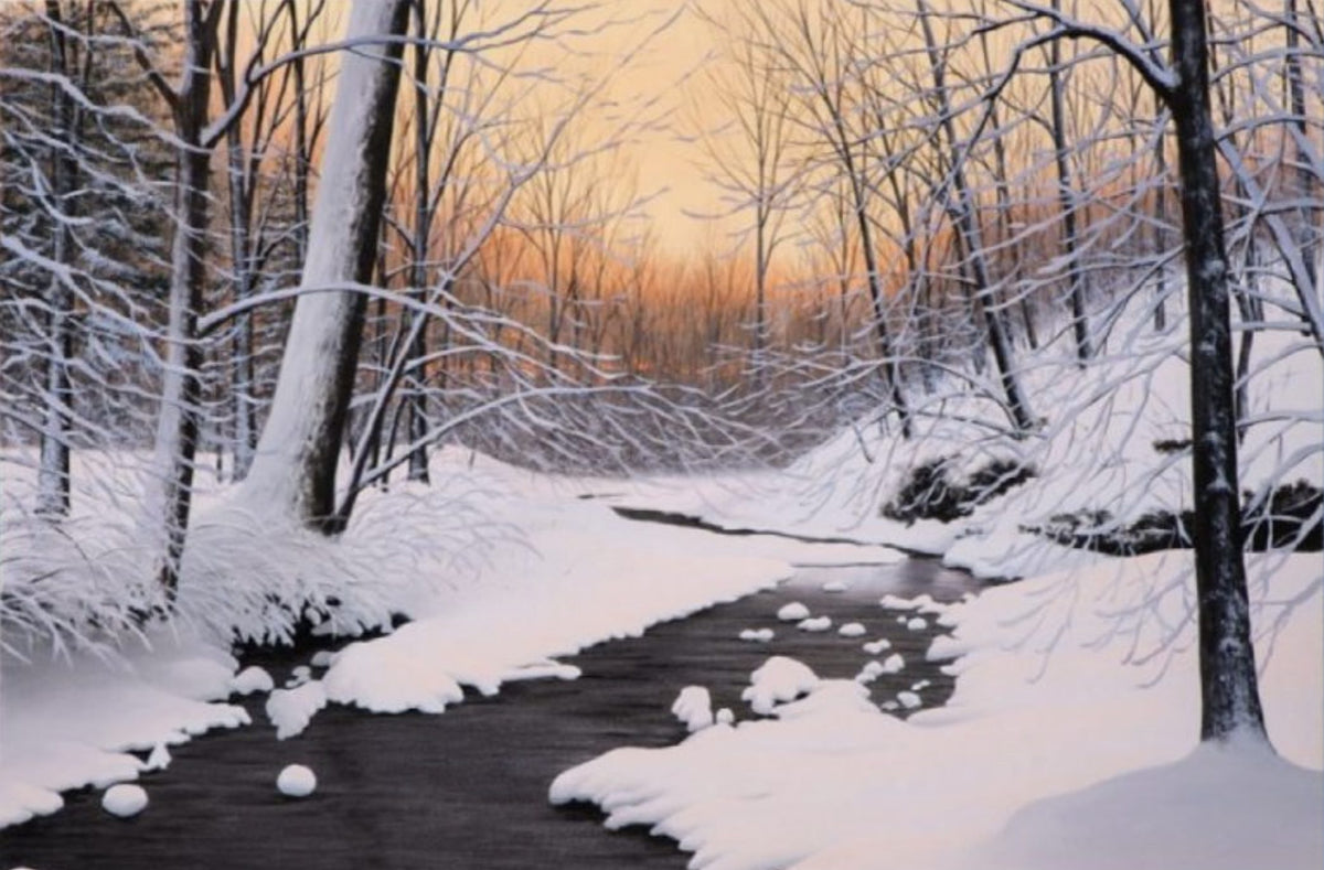 A winter landscape reminiscent of Lake Tahoe is beautifully captured in Winter Silence, featuring a snow-covered forest, a winding creek lined with bare trees, and an orange-hued sky at sunrise or sunset. Snow blankets the ground and clings to branches, much like in Alexander Volkov’s art.