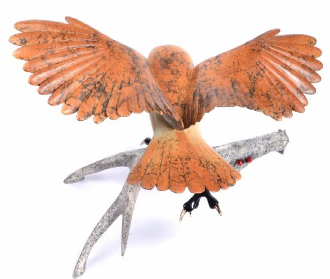Amelia is an expertly carved orange and brown bird sculpture with outstretched wings, perched on a gray branch with red accents—gallery-quality craftsmanship reminiscent of South Lake Tahoe art pieces.