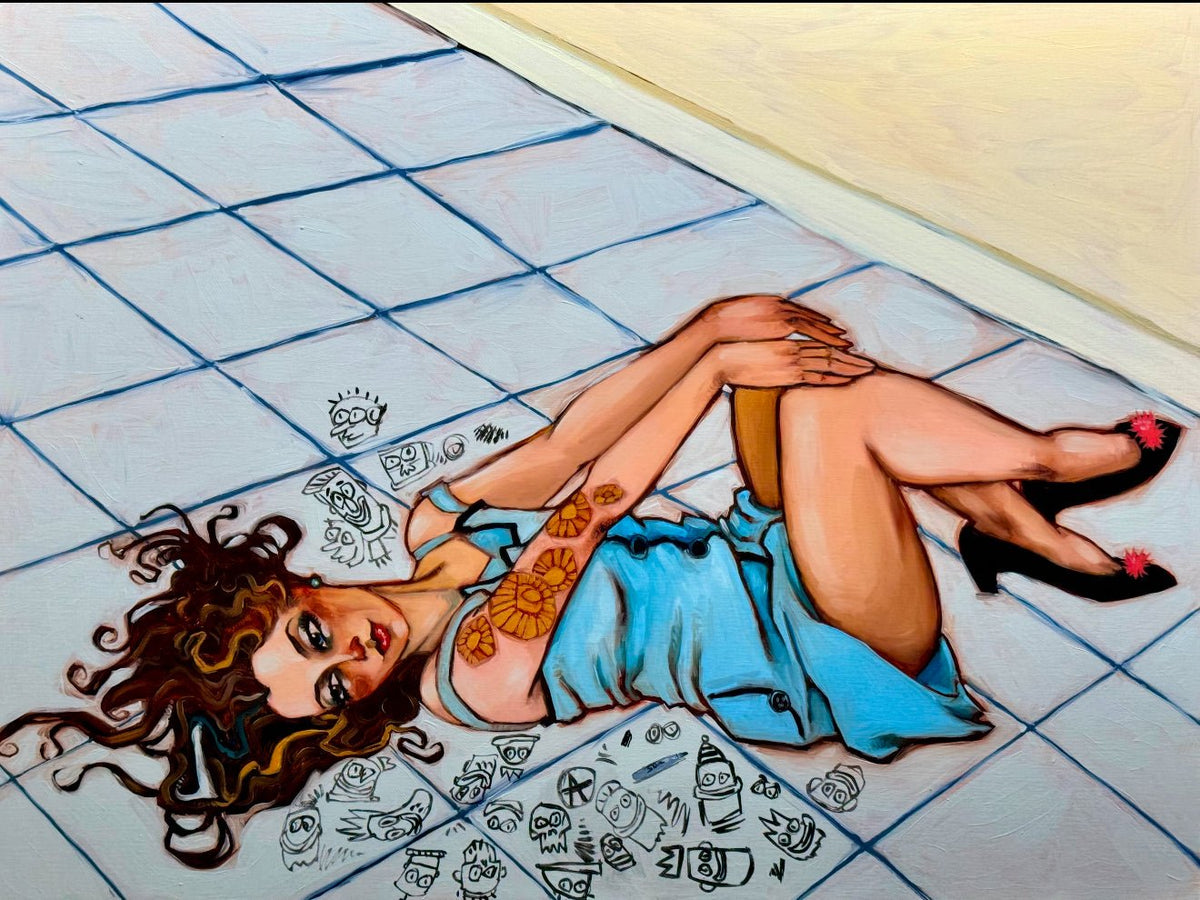 A woman with curly hair lies on a tiled floor, wearing a blue dress and black heels with pink accents, her arms folded to show a sun tattoo. Cartoonish doodles from Artistic Menace swirl around her like Todd Whites vibrant strokes.