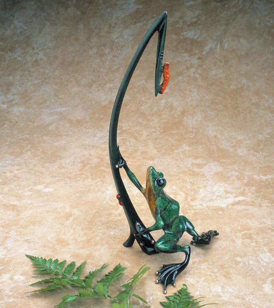 Dinner for Two, a bronze sculpture by Tim Cotterill, features a playful green frog lounging against a tall, curved plant. A colorful frog perches happily near the top, with a fern leaf in the foreground—a quintessential Frogman piece.