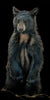 The Baby Bear artwork depicts a black bear standing on its hind legs against a dark backdrop. The artist intricately details the fur in brown and black, creating a lifelike presence as it gazes forward with paws by its sides, contemplating porridge or forest adventures.