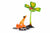 The Beginners Luck sculpture features a small orange frog gazing up at a green four-leaf clover with a red ladybug, capturing its whimsical charm against a white background.