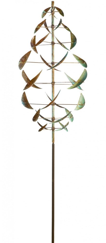 The Lyman Whitaker wind sculpture Double Dancer showcases curved metal pieces spiraling around a central pole, with an aged green patina that highlights its design. Vertically symmetrical, it resembles a stylized leaf or abstract helix in motion.