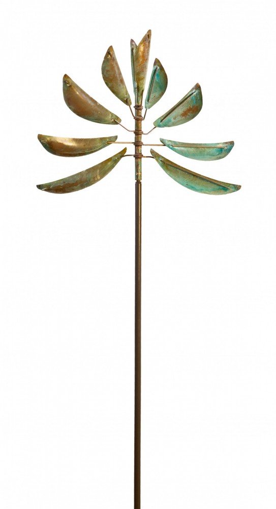 The Guardian Angel is a tall metal sculpture with curved, leaf-like elements symmetrically arranged around a central rod. Its weathered, patinated finish in copper and green reflects Lyman Whitakers art displayed at Marcus Ashley Gallery in Lake Tahoe.