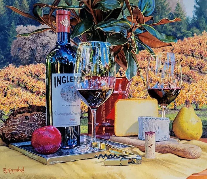 Harvest Time features a vibrant still life of an Inglenook Cabernet Sauvignon bottle, wine glasses, cheeses, a pear, apple, and bread against a sunlit vineyard backdrop with leafy branches in Eric Christensens signature watercolor style.
