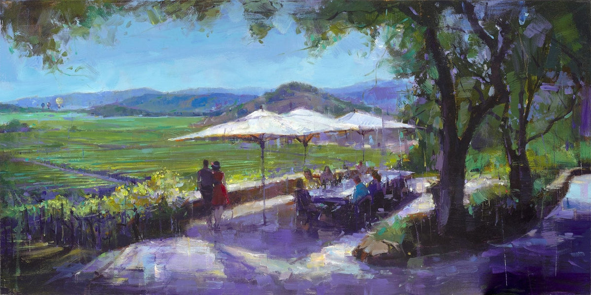 A vibrant painting titled Joie de Vivre depicts a sunlit outdoor café with patrons under white umbrellas, overlooking Napa Valleys lush vineyards. A couple walks nearby, embraced by the shade of large trees, amidst the lively greens, purples, and blues.