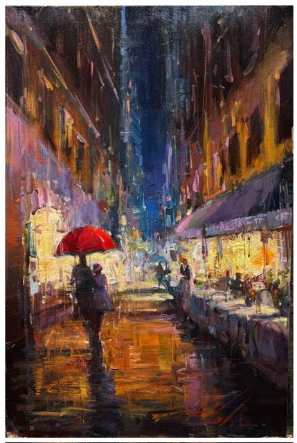 Moments to Remember by Michael Flohr portrays a vibrant, rainy urban street at night. A person with a red umbrella crosses the wet, reflective pavement as bright lights illuminate the impressionistic city atmosphere.