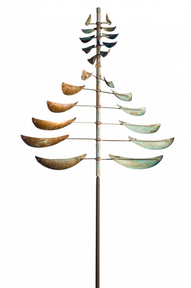 The Sail is a vertical metal sculpture similar to Lyman Whitaker art, resembling a tree with crescent-shaped sails at different angles on a central pole. These wind sculptures feature a weathered appearance in green and rusted brown tones.
