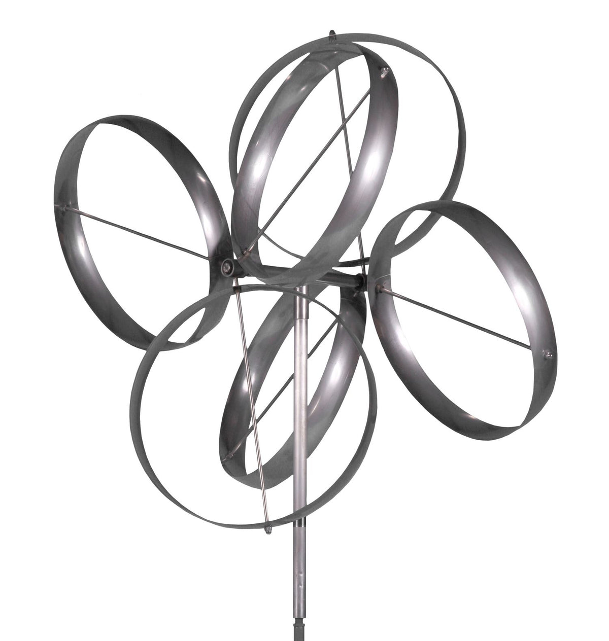 The Shamrock - Stainless Steel by Lyman Whitaker, with five circular metal rings on a vertical pole, spins gracefully like a blossoming flower. Discover its radiance at Marcus Ashley Gallery near the serene landscapes of Lake Tahoe.