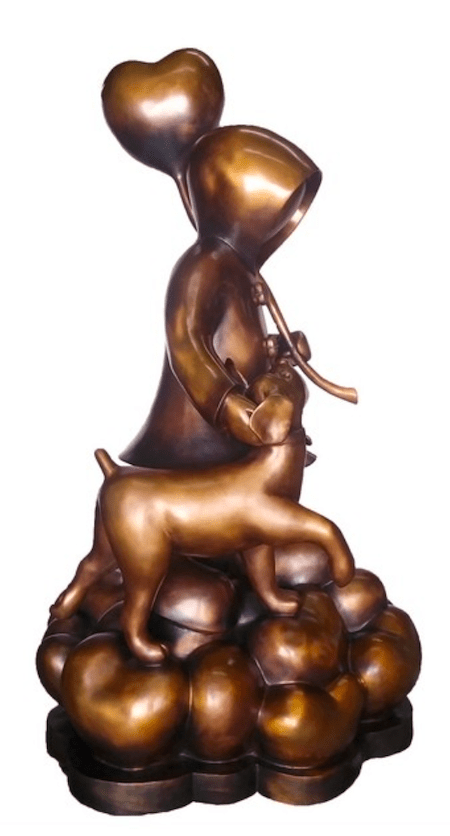The limited edition Stepping Stones bronze sculpture by Mackenzie Thorpe features a hooded figure and a dog on rounded forms, with the figure holding a heart-shaped balloon. This whimsical, storybook scene beautifully captures the essence of love.