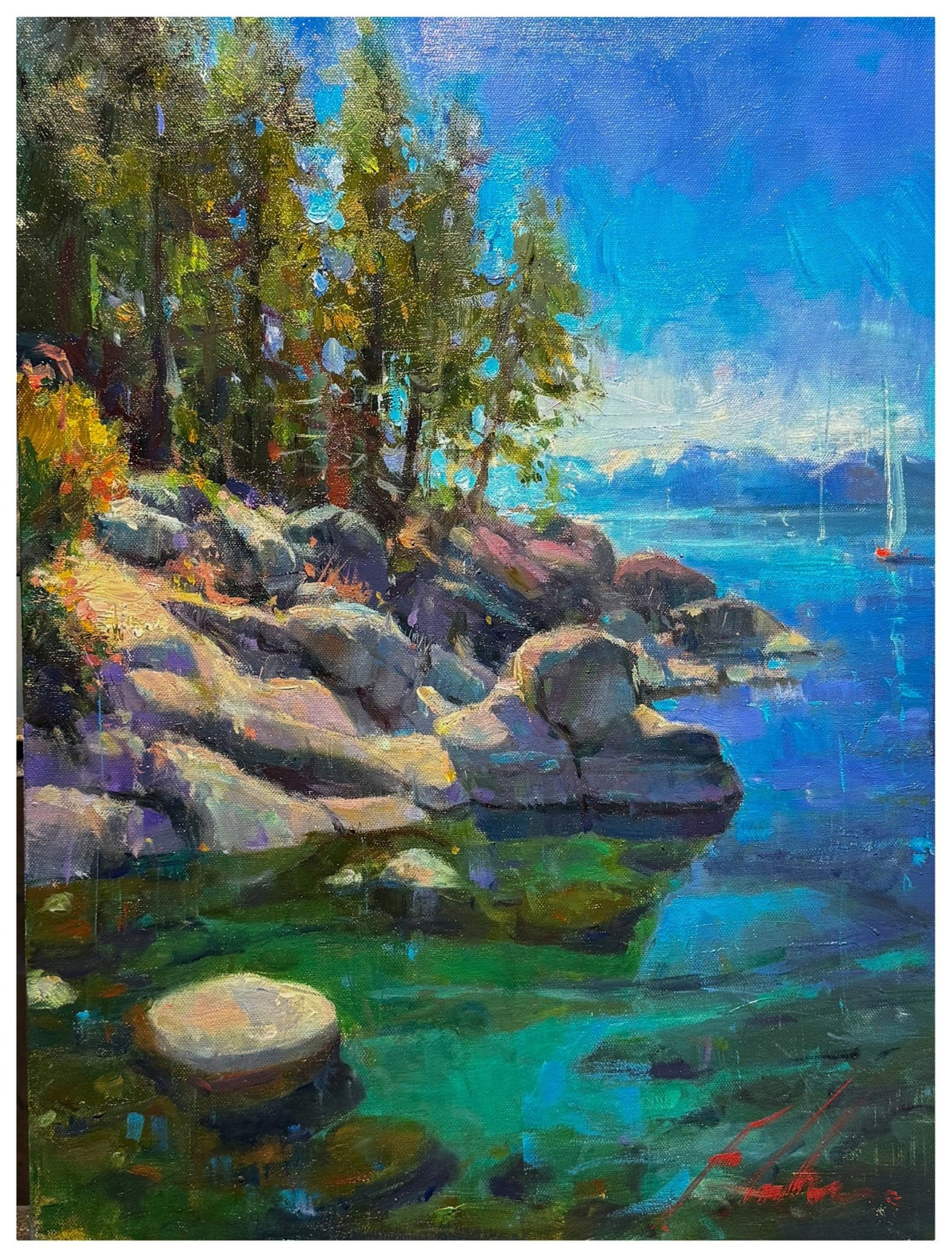 Tahoe Shore is a vibrant painting that depicts an impressionistic rocky Lake Tahoe shoreline, featuring clear blue water. Tall trees and their reflections are captured on the left, while sailboats gently drift in the distance against majestic mountains and a bright blue sky.