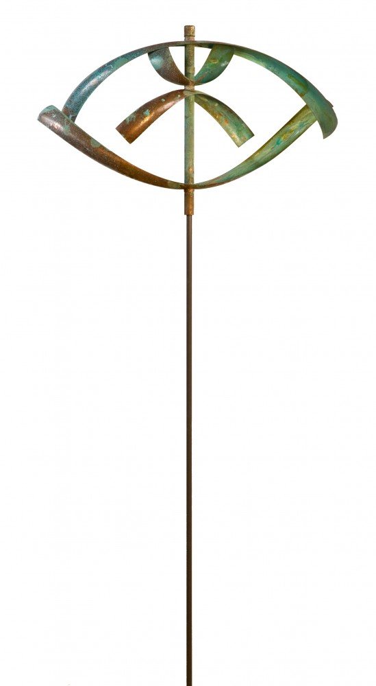 The Elements - Water sculpture, resembling an eye on a slender rod, captures fluidity. Inspired by Lyman Whitakers wind sculptures, its weathered greenish-brown patina strengthens its natural aesthetic.