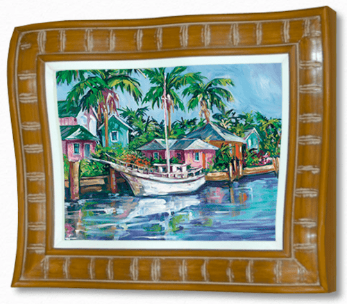 The By the Bay framed painting portrays a vibrant coastal landscape with palm trees, small houses, and a white boat on blue water. Resembling Steve Bartons style, it features an intricately carved wooden frame.