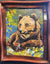 Bleu by Steve Barton is a colorful wildlife painting featuring a brown bear resting on grass among flowers, set against green and yellow foliage. The vibrant artwork, signed BARTON, comes displayed in a wooden frame.