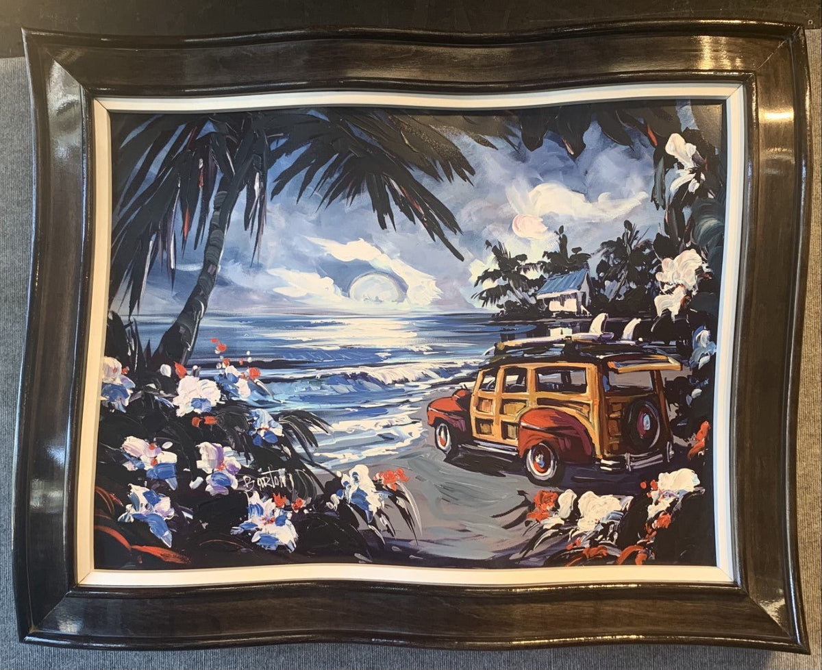 The painting By the Moonlight features a seaside sunset scene with a classic wood-paneled car by a beach adorned with palm trees and flowers. Waves crash gently under the moonlit sky, all captured in Steve Barton arts distinctive wavy frame.