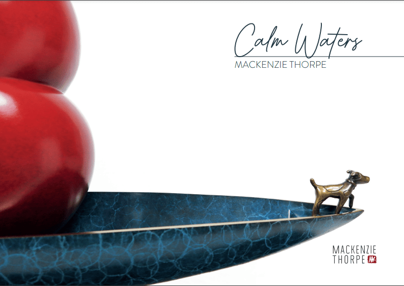 The Calm Waters sculpture, showcased at Marcus Ashley Gallery, comprises a blue decorative tray with three large red spheres and a small bronze dog figurine gazing at them against a white backdrop.