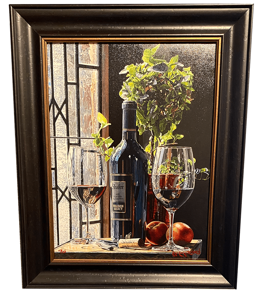 Contemplation by Eric Christensen is a stunning framed painting showcasing a wine bottle, two filled glasses, peaches, and a potted plant on a wooden surface near a window. Sunlight streams in, casting reflections that highlight the beauty of hyperrealist watercolor art.