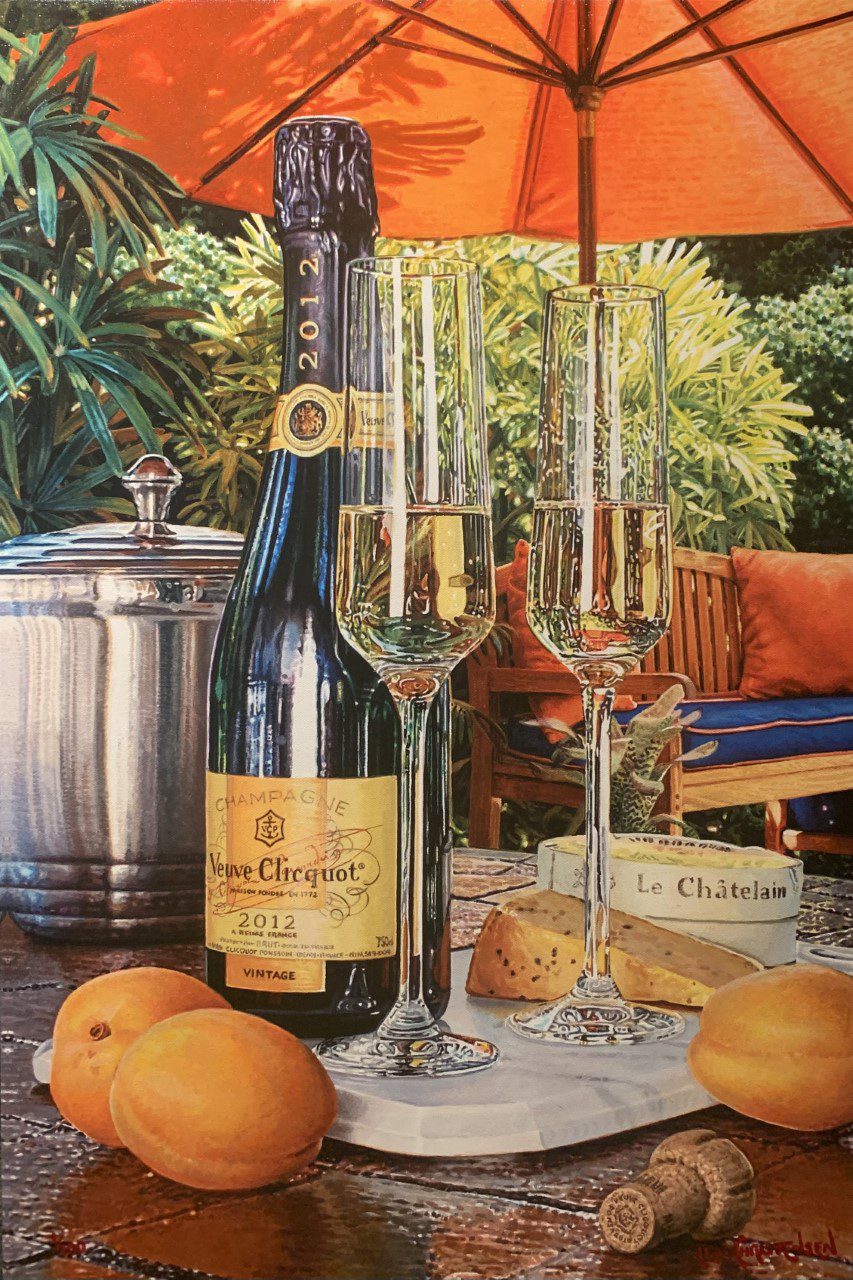 A bottle of Veuve Clicquot champagne with two filled flutes adorn an outdoor table, reminiscent of an Eric Christensen painting. Apricots, Le Châtelain cheese, a metallic ice bucket, and a large orange umbrella enrich this perfect scene for French Connection wine art collectors.