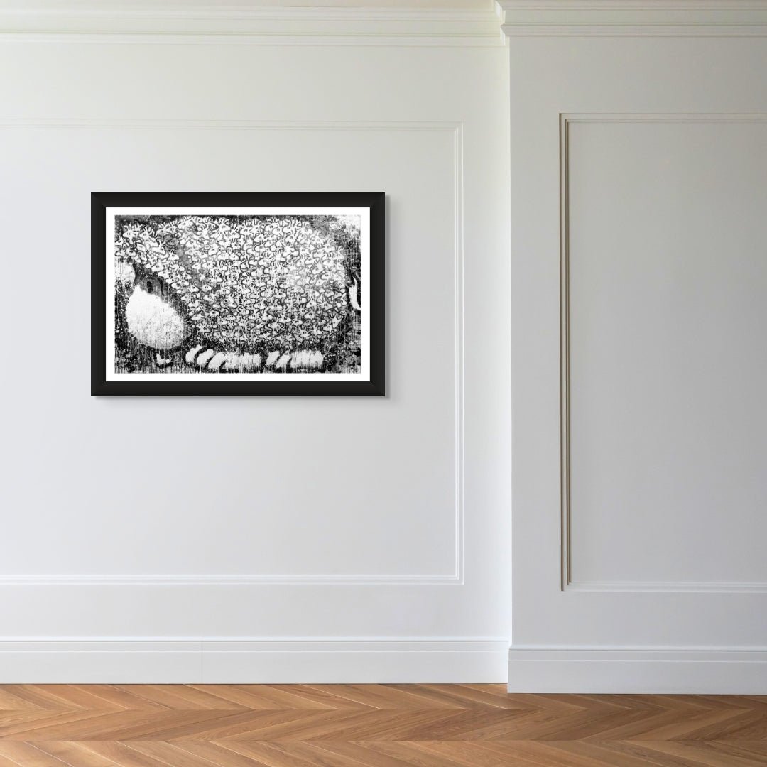 The artwork titled Does This Make Me Look Fat is a framed black and white abstract piece featuring a textured, pixelated design with a large circular shape. Displayed on a white wall with wooden flooring and decorative moldings, it exudes sophistication reminiscent of Tom Everharts bold style.