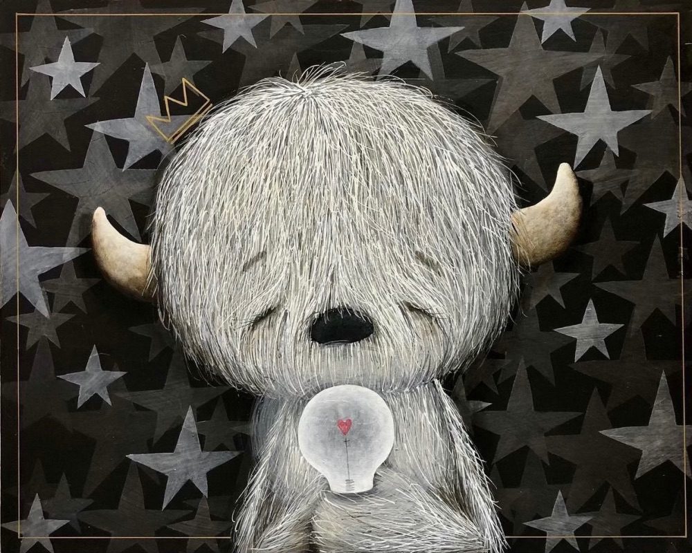 Darwin the Yeti from Respectfully with Love wears a crown and holds a glowing lightbulb with a red heart. Set against Fabio Napoleoni-inspired gray stars, this scene symbolizes creativity and innovation.