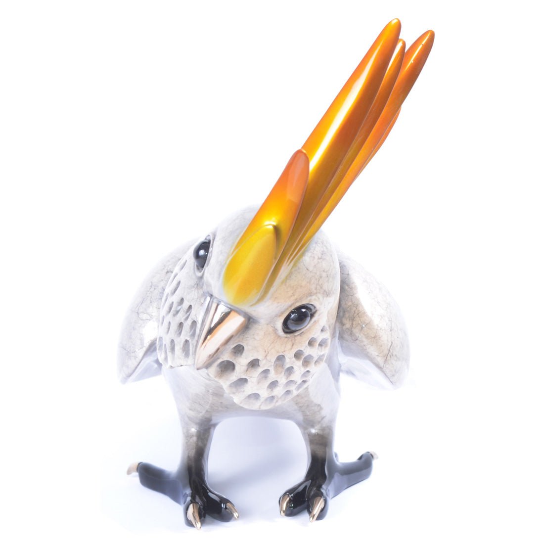 Caruso is a sculpture of a stylized bird featuring a cracked silver finish, vibrant orange and yellow elongated crest feathers, and metallic beak and feet, inspired by Frogman art for a modern touch.