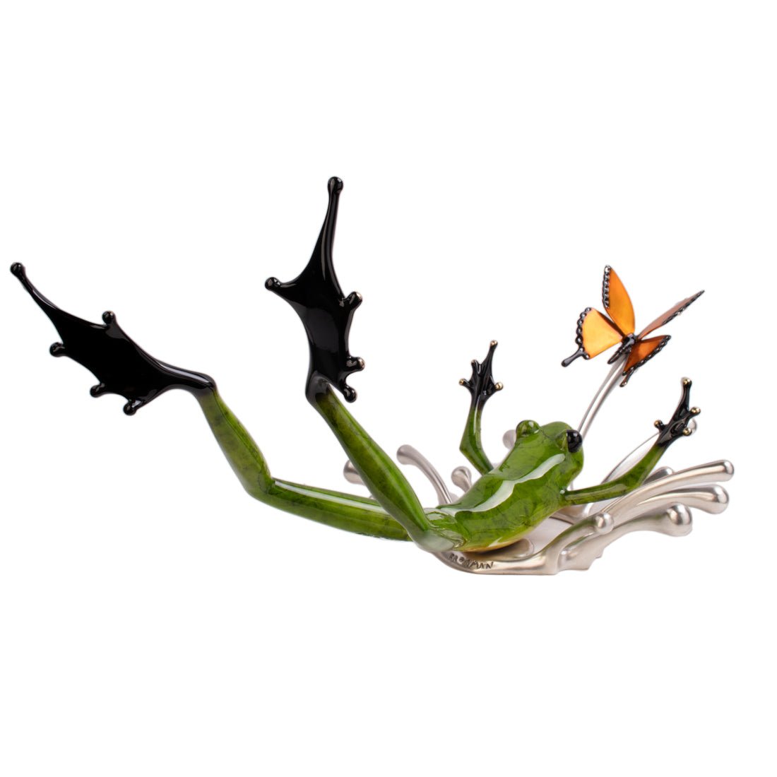 Admire Splashdown, a whimsical Frogman sculpture at Marcus Ashley Gallery by Lake Tahoe, showcasing a green frog on its back with black webbed feet up and an orange butterfly on its extended forefinger.