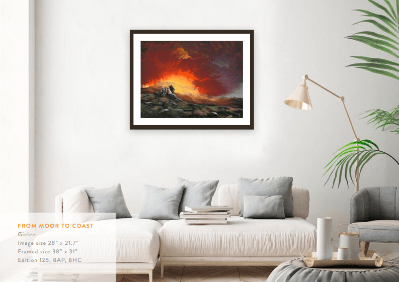 A white sofa with cushions sits below Mackenzie Thorpes dramatic giclée From Moor To Coast. A lamp and a plant enhance the setting. Text on the wall provides size and edition details of this paper artwork.