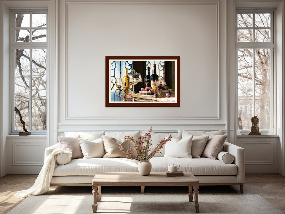 A cozy living room features a white sofa with beige cushions and a wooden coffee table topped with flowers. A colorful painting named La Dolce Vita hangs above, enhancing the charm. Large windows offer natural light, and a potted plant adds greenery to this ideal spot for enjoying dessert wine.