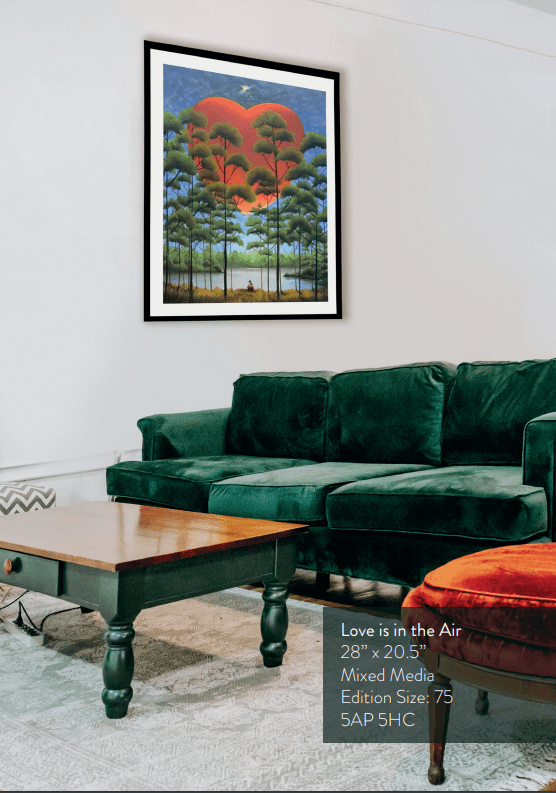 A living room showcases a green velvet sofa and wooden coffee table. A framed Mackenzie Thorpe painting, Love is in the Air, featuring Lake Tahoe with trees and a red sun on a blue sky, hangs on the wall. To the right, a small, round red chair complements the artworks theme.