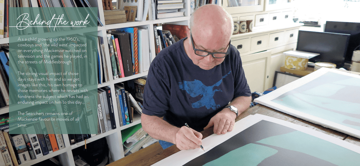 A person sits at a table, signing The Searchers, a large print with abstract geometric shapes. Shelves filled with books and art supplies are in the background. A text block on the left explores how 1960s Western movies influenced the artists work.