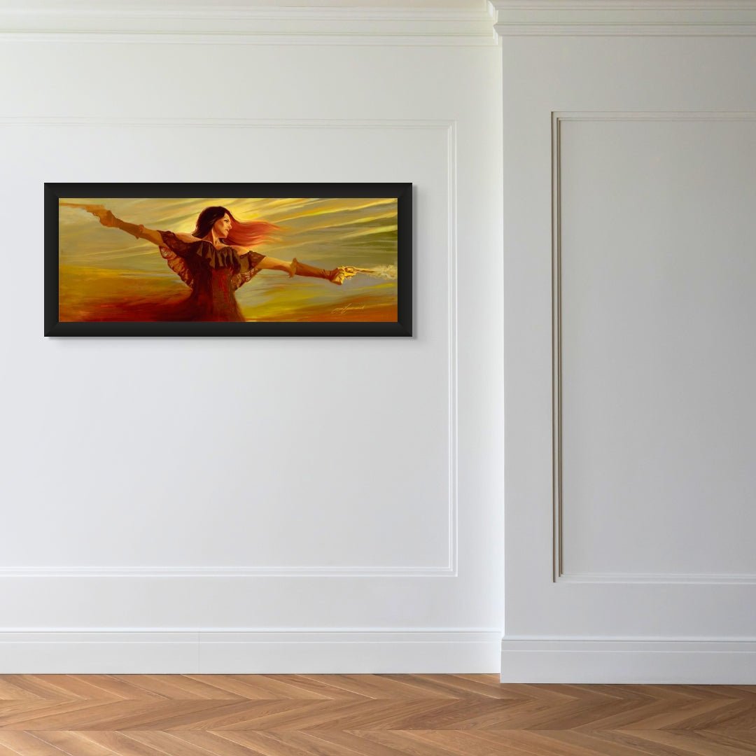 In a minimalist room with white paneled walls and wooden floors, an art collection is featured. Spirit, a framed painting of a woman with outstretched arms and flowing red hair symbolizing freedom and empowerment, hangs on the wall amid warm, swirling colors.