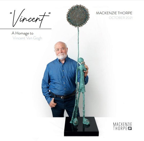 A person in a blue shirt stands beside Mackenzie Thorpes Vincent, a tall, slender sculpture with a large circular head-piece, titled Vincent: A Homage to Vincent Van Gogh, dated October 2021.