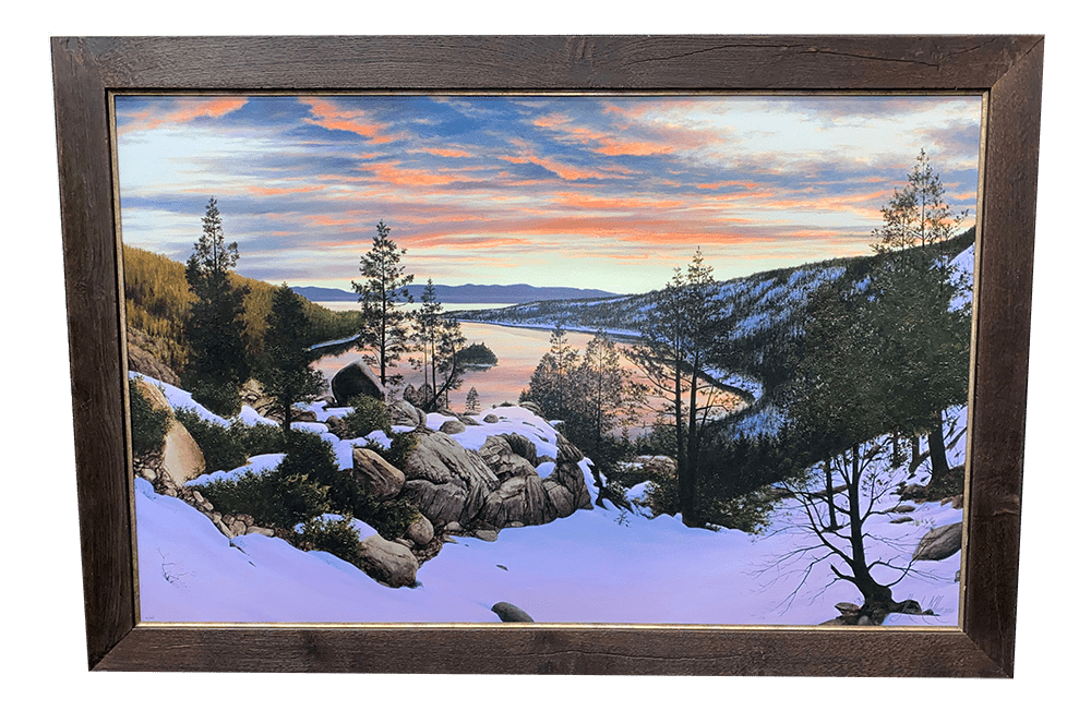 The framed painting Emerald Bay Sunrise depicts a winter landscape at Lake Tahoe, featuring snow-covered trees and rocks. A river winds through the valley, reflecting a vibrant sunset sky with pink and orange clouds in an Alexander Volkov style.