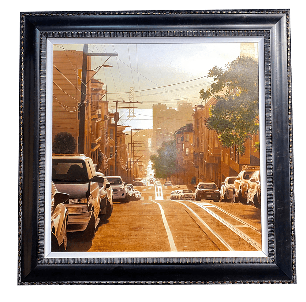 This framed oil painting, titled San Francisco Morning Bay Bridge, depicts a sunlit urban street scene. Cars line the steep hill, flanked by buildings and trees, with power lines overhead. The sky glows warmly with golden light, evoking the fine art style of Alexander Volkov.