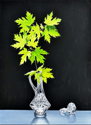 A clear, intricately cut glass pitcher holds green maple leaves on a black background, evoking Alexander Volkovs art. Nearby, a matching stopper rests on a reflective surface. This is captured in Young Maple Still Life, reflecting the essence of realism oil paintings and soul medicine.